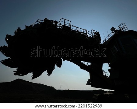 Silhouette of giant bucket wheels excavator. A strong and iconic openpit minning machinery
