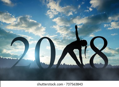 Silhouette eines Mädchens, das im Neujahr 2018 Yoga praktiziert.