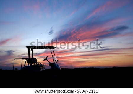 silhouette golf cart in golf course with colorful twilight sky soft cloud for background backdrop use
