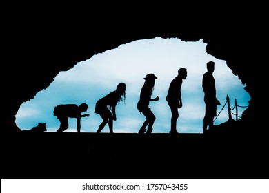 silhouette of a group of friends with dog in a cave in ibiza. human evolution and fun