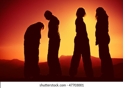 Silhouette Of A Group Of People On Sunset