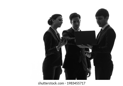 Silhouette Of Group Of Talking Businesspeople.