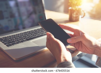 Silhouette, hand of woman using smart phone and notebook computer, Technology concept, flare light - Shutterstock ID 676435516