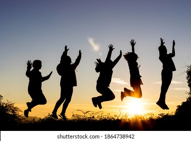 Silhouette Friends Jumping On Beach During Stock Photo (Edit Now) 92361418