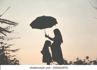 silhouette of a happy family and happy time sunset
