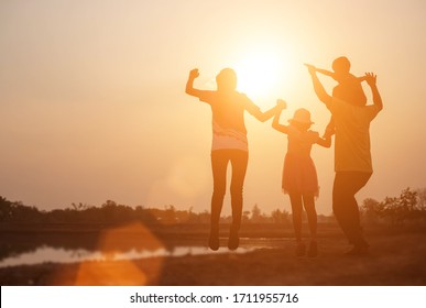 Silhouette Of A Happy Family And Happy Time Sunset