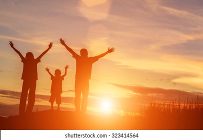 Silhouette Of A Happy Family And Happy Time Sunset