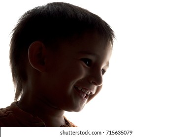 Silhouette Of Happy Laughing Child Face On White Isolated Background