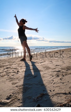 Similar – Young, slim woman on the beach of the Baltic Sea in summer wind