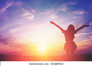 Silhouette Of A Happy Woman And Sunset