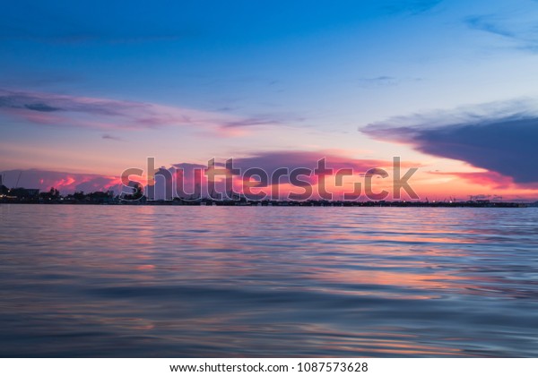 Silhouette of Harbor with sunset in Sriracha\
Chonburi, Thailand\
