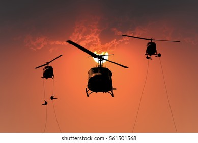  Silhouette Of Helicopter, Soldiers Rescue Helicopter Operations On Sunset Sky Background.