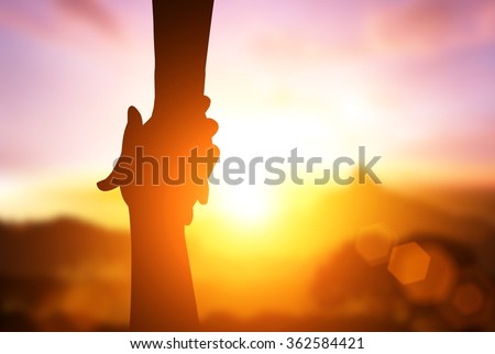 silhouette of  helpping hand  and hope concept and international day of peace.how can i help you