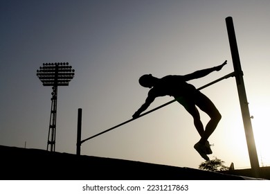 Silhouette of high jumper athlete in pole vault - Shutterstock ID 2231217863