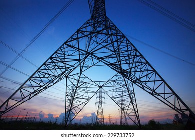 Silhouette Of High Voltage Electric Pole Against Beautiful Dusky Sky Use As Electric Power And Energy Industry Background,backdrop Scene