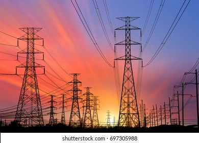Silhouette High voltage electric tower on sunset time and sky on sunset time background. - Shutterstock ID 697305988