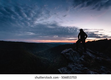 Silhouette of a hiker, climber at sunset