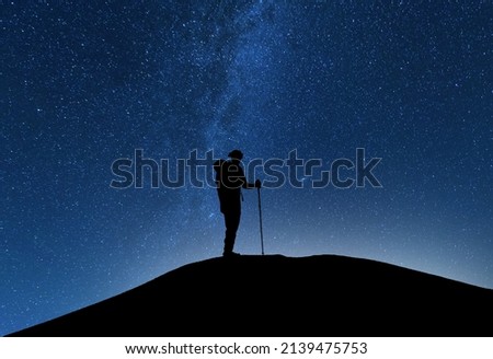 Similar – Image, Stock Photo People hiking at night. Mountains at sunrise. Man standing on peak. Natural mountain landscape with illuminated misty peaks, foggy slopes and valleys