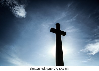Silhouette of a holy cross with dramatic blue sky - Shutterstock ID 1714709389