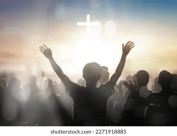 Silhouette human raising hands to praying God on blurred cross  background - Shutterstock ID 2271918885