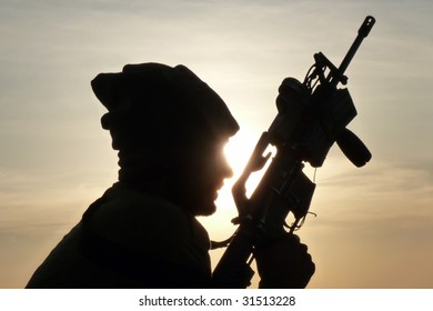 Silhouette Of An IDF Soldier Testing His M16