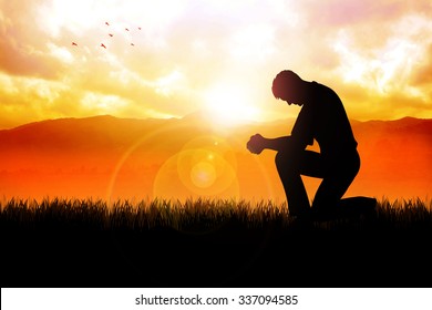 Silhouette illustration of a man praying outside at beautiful landscape - Shutterstock ID 337094585