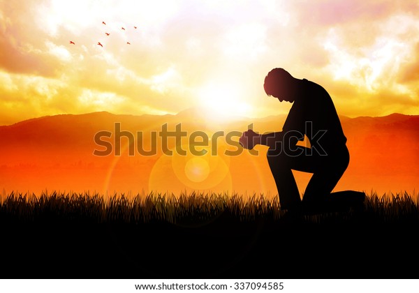 Silhouette illustration of a man praying\
outside at beautiful\
landscape