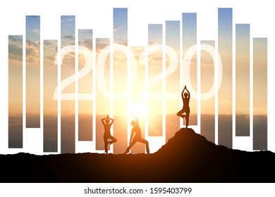 Silhouette Image Of People Group Posting Yoga On Beautiful Sunrise Background, Relax, Healthy For 2020.