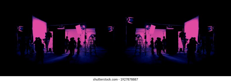 Silhouette Images Of Video Production Behind The Scenes. Making Of TV Commercial Movie That Film Crew Team Lightman And Cameraman Working Together With Film Director In Studio. Film Production Concept