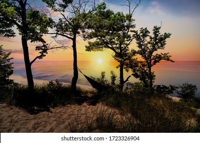 The Silhouette Of Indiana Dunes State Park Landscape Overlooking Lake Michigan At Sunset Near Porter, Indiana, USA.