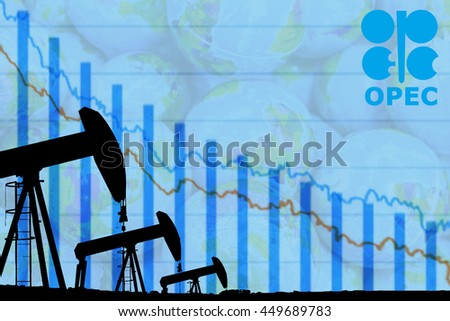 silhouette industrial oil pump jack and falling oil graph on the blue globe background