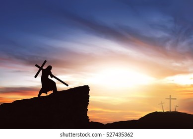 Silhouette Of Jesus Carry His Cross On The Hill