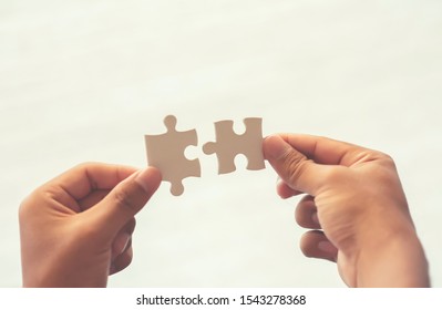 Silhouette /Jigsaw indicates teamwork and business collaboration. - Shutterstock ID 1543278368