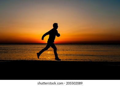 Silhouette Jumping Man On Sunrise Background Stock Photo 205502089 ...