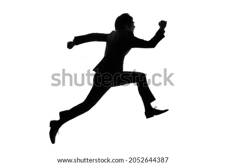 Silhouette of jumping young asian businessman.