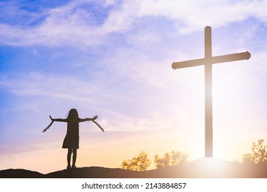 Silhouette kid break chains freedom.Kid Holy Cross of christian and Jesus Christ.Good friday, easter day.The Feast of Corpus Christi.easter.Good friday.Faith, Holy week,Church Worship in Good friday. - Shutterstock ID 2143884857