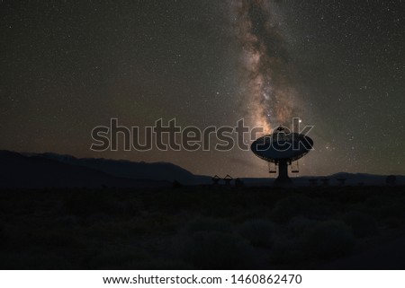 Silhouette of a large dish antenna aligned with the Milky Way Galaxy from Big Pine, California 