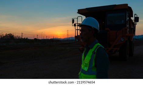 Silhouette Of A Large Truck Driver. Asian Elders.