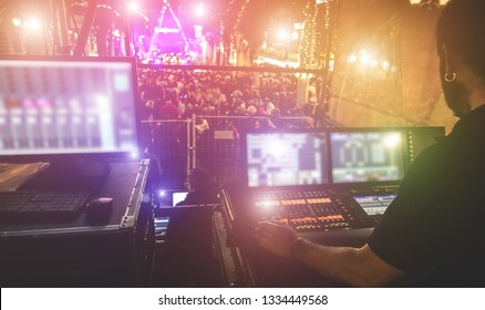 Silhouette Of Lights Technician Working At Event Concert - Sound System And Lighting Duric Music Festival Outdoor - Focus On Hand - Technology And Entertainment Concept