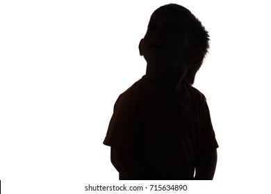 silhouette of little boy looking up on white isolated background