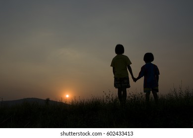 Silhouette Little Girl Hold Hands Sister Stock Photo (Edit Now) 602433413