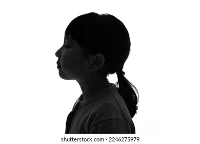 Silhouette of little girl profile. - Shutterstock ID 2246275979