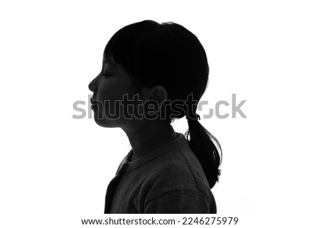 Silhouette of little girl profile.