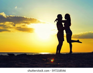 silhouette of lovers at sunset