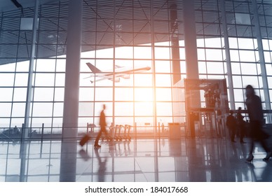 Silhouette of  luggage walking at airport