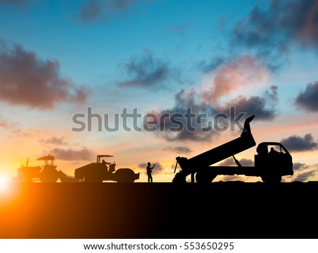Silhouette machinery work construction road plan to connect Heavy industry and safety at work concept and support transportation business and journalism over blurred natural background sunset pastel.