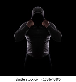 Silhouette Of A Male Fight Club In A Hood Without A Face. Stalker Silhouette On Black Background, Incognito, Anonymous, Dangerous Man, Thug In The Dark. Sporty Man With Big Muscles