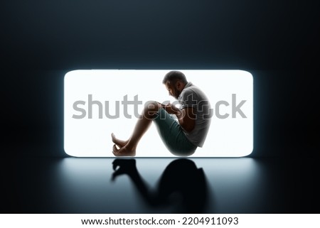 Silhouette of a male prisoner in a smartphone. Social media addiction, internet addiction, smartphone addiction. social disease. Modern design, magazine style