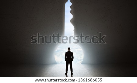 Silhouette of man against giant key shape portal. Free your mind concept