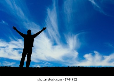 Silhouette of man with arms outstretched to the sky. - Powered by Shutterstock